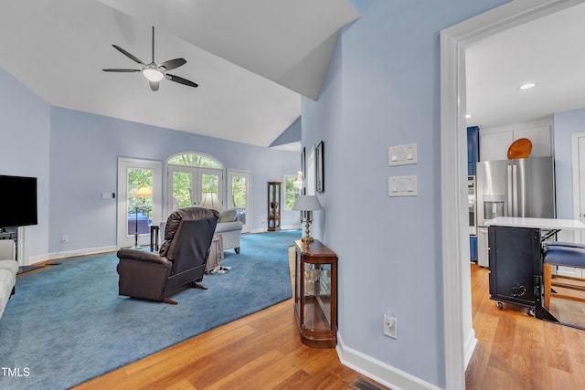 103 Javelin Ct, Cary, NC 27513 - living room featuring light wood-style floors, ceiling fan, high vaulted ceiling, and recessed lighting