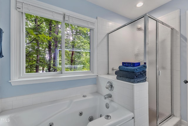 103 Javelin Ct, Cary, NC 27513 - full bath with plenty of natural light, a shower stall, and a jetted tub