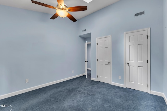 103 Javelin Ct, Cary, NC 27513 - unfurnished bedroom with dark colored carpet, a high ceiling, and a ceiling fan