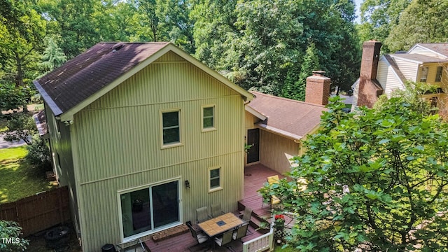 6701 Winding Trl, Raleigh, NC 27612 - rear view of house with a shingled roof, a deck, and a chimney