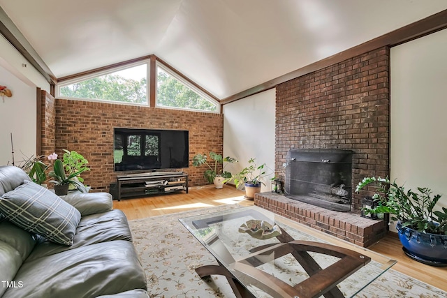 6701 Winding Trl, Raleigh, NC 27612 - living room featuring wood finished floors, lofted ceiling, and a fireplace