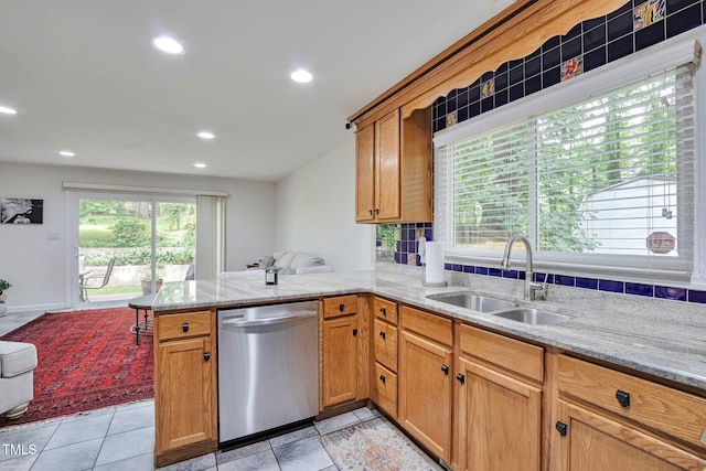 6701 Winding Trl, Raleigh, NC 27612 - kitchen featuring stainless steel dishwasher, a peninsula, light stone counters, brown cabinetry, and recessed lighting