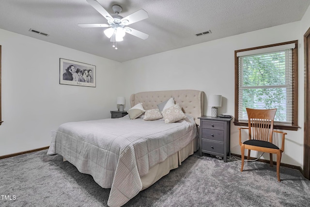 6701 Winding Trl, Raleigh, NC 27612 - bedroom featuring carpet, a ceiling fan, and a textured ceiling