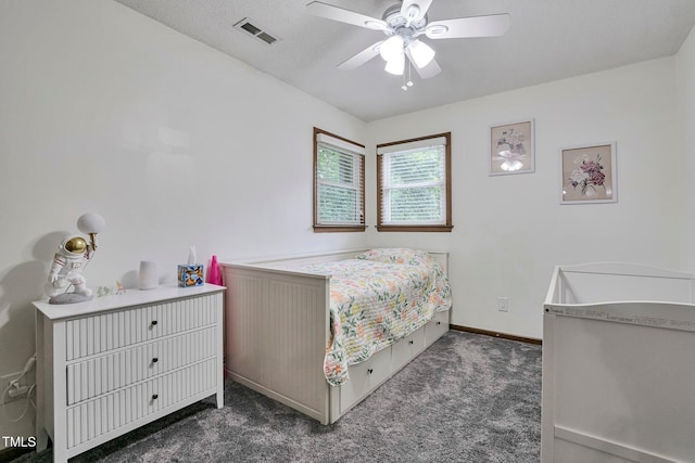6701 Winding Trl, Raleigh, NC 27612 - bedroom featuring dark carpet and ceiling fan