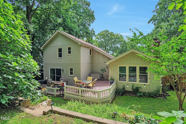 6701 Winding Trl, Raleigh, NC 27612 - back of house featuring a wooden deck, outdoor dining area, and a lawn