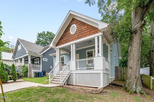 1920 Hart St, Durham, NC 27703 - shotgun-style home featuring covered porch and stairs