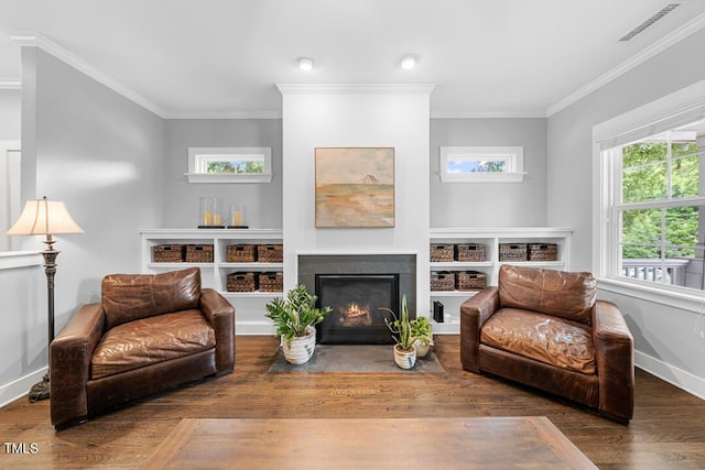 1920 Hart St, Durham, NC 27703 - living area featuring crown molding, wood finished floors, and a fireplace with flush hearth