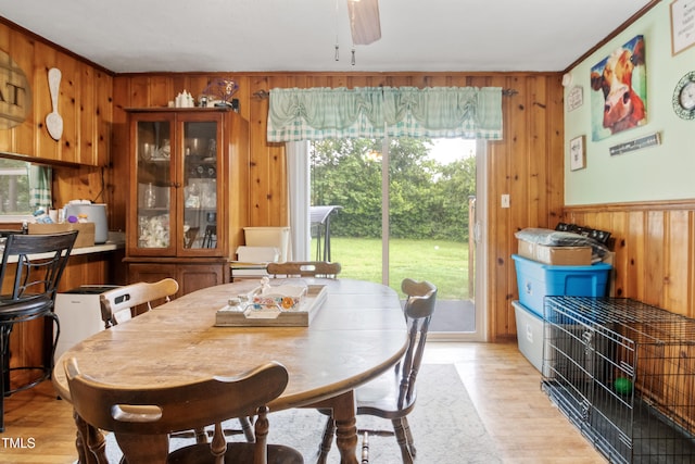 2037 Mango Cir, Fayetteville, NC 28304 - dining area featuring wooden walls, light wood-style floors, and ceiling fan