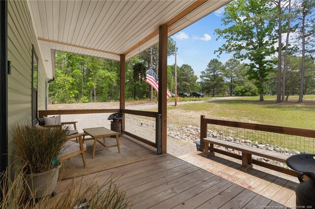 588 Heritage Farm Rd, Carthage, NC 28327 - deck featuring a yard and view of wooded area
