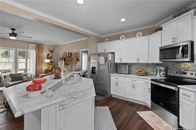 588 Heritage Farm Rd, Carthage, NC 28327 - kitchen with stainless steel appliances, dark wood-style floors, a kitchen island, backsplash, and ornamental molding