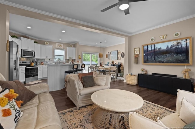 588 Heritage Farm Rd, Carthage, NC 28327 - living area featuring wood finished floors, ornamental molding, a ceiling fan, and recessed lighting