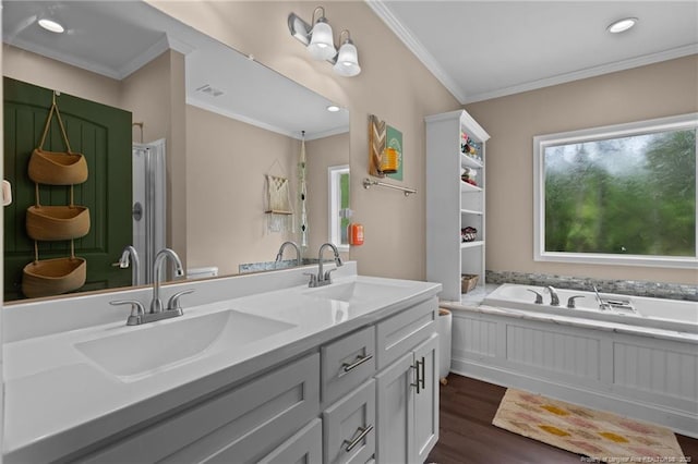 588 Heritage Farm Rd, Carthage, NC 28327 - bathroom featuring ornamental molding, a garden tub, double vanity, wood finished floors, and a stall shower