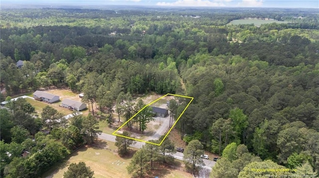 588 Heritage Farm Rd, Carthage, NC 28327 - aerial view of property and surrounding area with a forest and property parcel outlined
