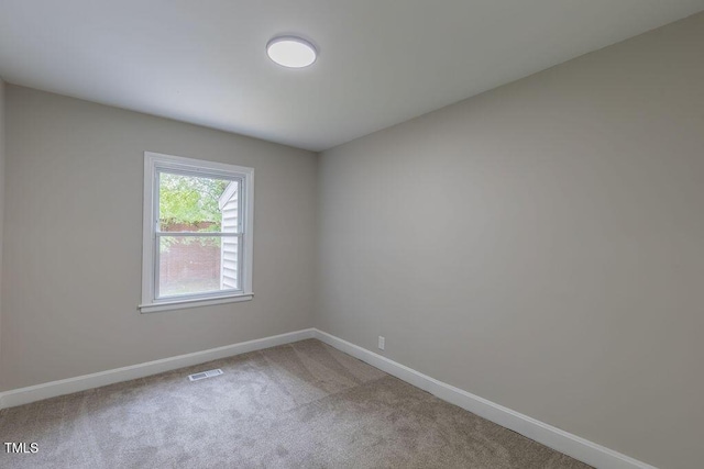 1708 Forest Rd, Durham, NC 27705 - carpeted empty room featuring baseboards