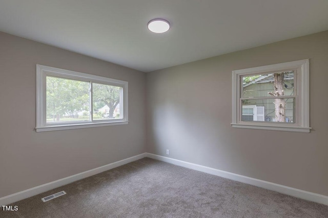 1708 Forest Rd, Durham, NC 27705 - spare room with carpet floors and baseboards