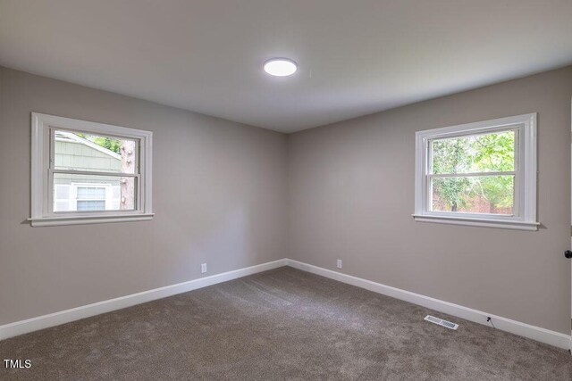 1708 Forest Rd, Durham, NC 27705 - empty room featuring baseboards and carpet