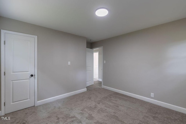 1708 Forest Rd, Durham, NC 27705 - spare room with carpet floors and baseboards