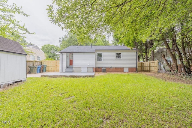 1708 Forest Rd, Durham, NC 27705 - back of house with a patio area, entry steps, a fenced backyard, and crawl space