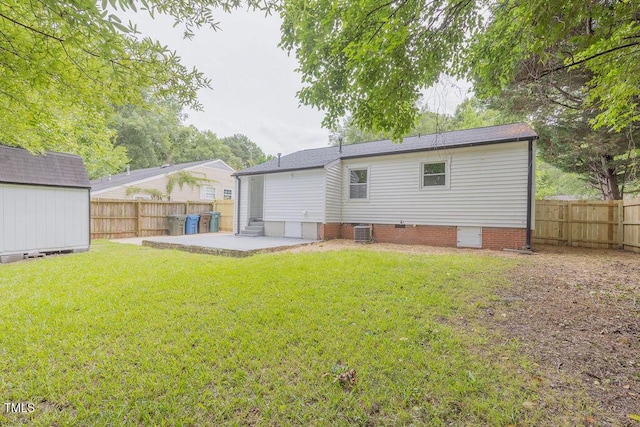 1708 Forest Rd, Durham, NC 27705 - rear view of property with a patio area, a fenced backyard, a storage shed, and crawl space