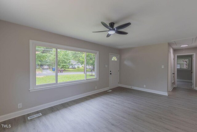 1708 Forest Rd, Durham, NC 27705 - unfurnished room featuring wood finished floors, attic access, and ceiling fan