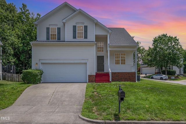2241 Spruce Shadows Ln, Raleigh, NC 27614 - view of front of house with a porch, a garage, and driveway