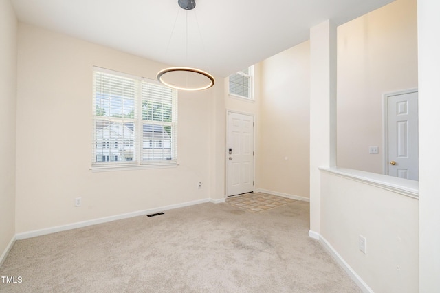 2241 Spruce Shadows Ln, Raleigh, NC 27614 - unfurnished dining area with carpet floors and baseboards