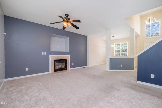 2241 Spruce Shadows Ln, Raleigh, NC 27614 - unfurnished living room featuring ceiling fan, a high end fireplace, and carpet flooring
