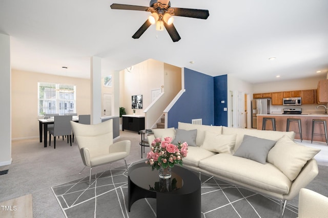 2241 Spruce Shadows Ln, Raleigh, NC 27614 - carpeted living room featuring stairs, ceiling fan, and recessed lighting