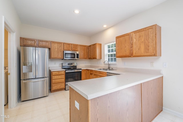 2241 Spruce Shadows Ln, Raleigh, NC 27614 - kitchen featuring stainless steel appliances, a peninsula, light countertops, recessed lighting, and light floors