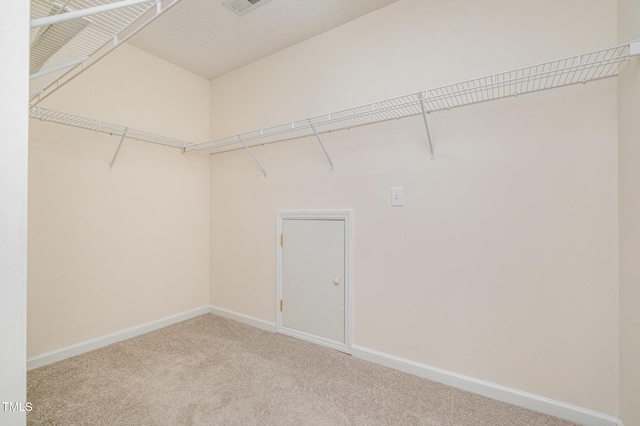 2241 Spruce Shadows Ln, Raleigh, NC 27614 - walk in closet with carpet flooring