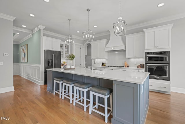 121 Hardy Oaks Way, Holly Springs, NC 27540 - kitchen featuring recessed lighting, a chandelier, high end refrigerator, custom exhaust hood, and a large island
