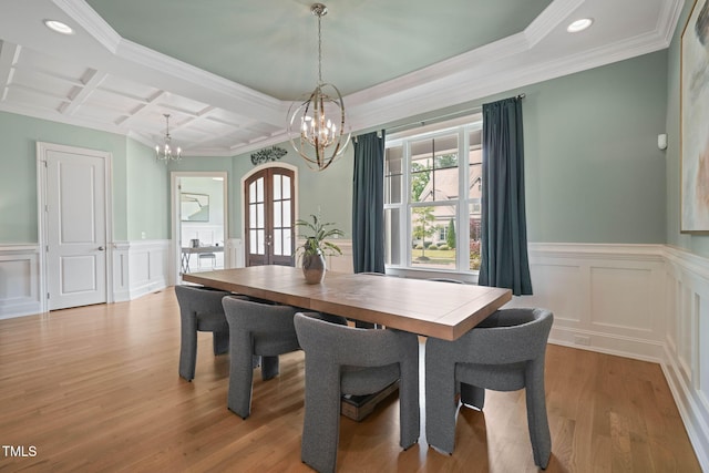 121 Hardy Oaks Way, Holly Springs, NC 27540 - dining room with a chandelier, coffered ceiling, light wood-style floors, ornamental molding, and french doors