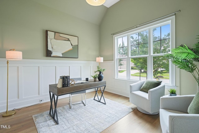 121 Hardy Oaks Way, Holly Springs, NC 27540 - office space featuring a decorative wall, wood finished floors, a wainscoted wall, and vaulted ceiling