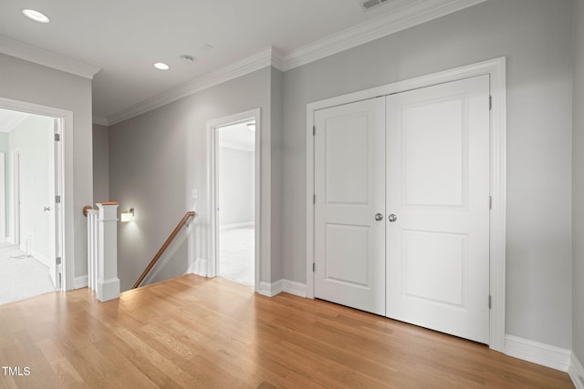 121 Hardy Oaks Way, Holly Springs, NC 27540 - corridor featuring an upstairs landing, light wood finished floors, ornamental molding, and recessed lighting