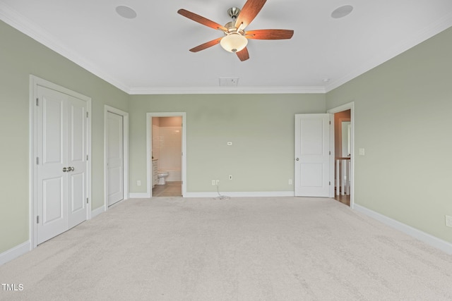 121 Hardy Oaks Way, Holly Springs, NC 27540 - unfurnished bedroom featuring crown molding, light carpet, connected bathroom, two closets, and ceiling fan