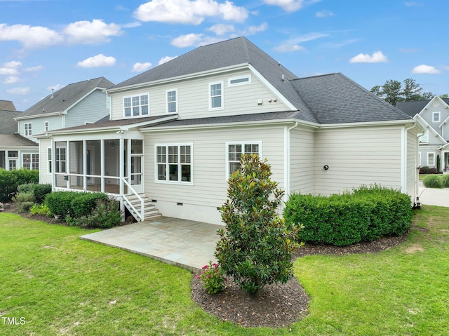 121 Hardy Oaks Way, Holly Springs, NC 27540 - rear view of property featuring a sunroom, a patio area, a lawn, and roof with shingles