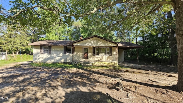 2100 N Webb St, Selma, NC 27576 - view of front of property featuring a porch, crawl space, and an attached carport