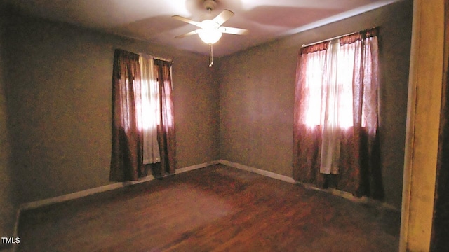 2100 N Webb St, Selma, NC 27576 - unfurnished room featuring a ceiling fan, plenty of natural light, and dark wood-style floors