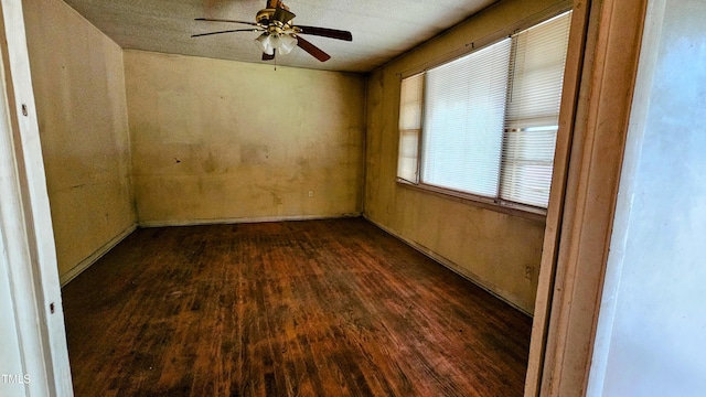 2100 N Webb St, Selma, NC 27576 - spare room featuring dark wood finished floors and a ceiling fan