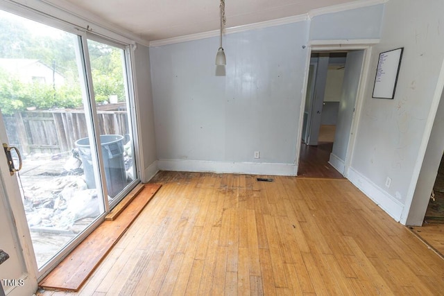 269 Beagle Run Ln, Aberdeen, NC 28315 - unfurnished dining area with light wood-type flooring and ornamental molding