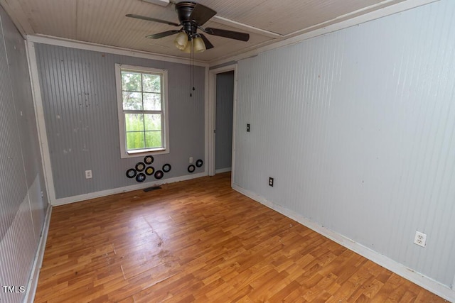 269 Beagle Run Ln, Aberdeen, NC 28315 - unfurnished room with light wood-type flooring, a ceiling fan, and wood walls