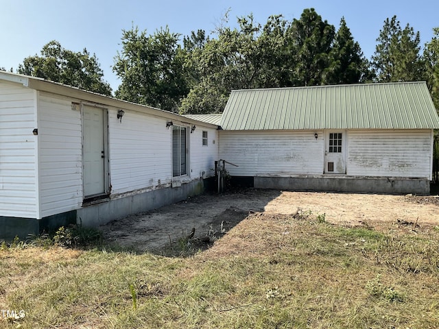 269 Beagle Run Ln, Aberdeen, NC 28315 - rear view of house with a metal roof