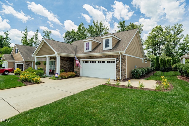 514 Ashley Woods Dr, Gibsonville, NC 27249 - view of front facade with stone siding, an attached garage, driveway, and a shingled roof