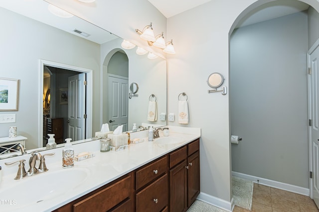 514 Ashley Woods Dr, Gibsonville, NC 27249 - full bath with double vanity and tile patterned flooring