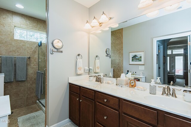 514 Ashley Woods Dr, Gibsonville, NC 27249 - bathroom with double vanity and a shower stall