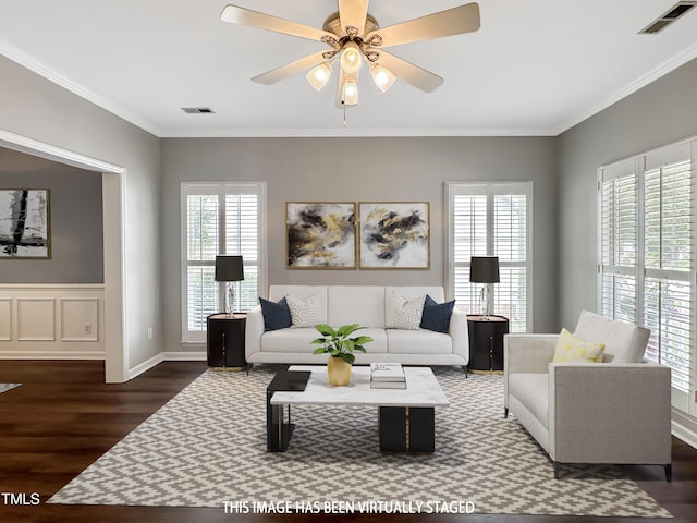 8640 Swarthmore Dr, Raleigh, NC 27615 - living area featuring plenty of natural light, wood finished floors, ceiling fan, and crown molding