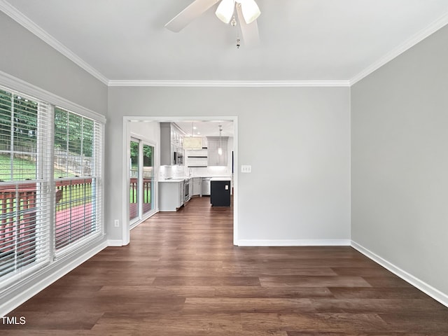 8640 Swarthmore Dr, Raleigh, NC 27615 - empty room featuring crown molding, ceiling fan, and dark wood-type flooring