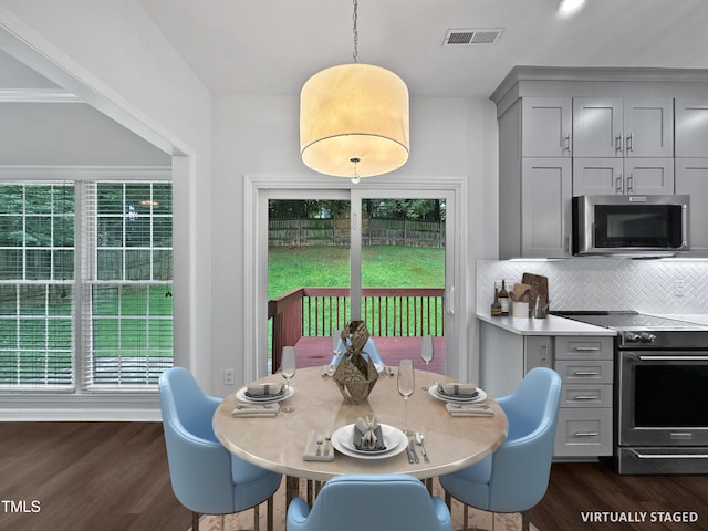 8640 Swarthmore Dr, Raleigh, NC 27615 - dining area with dark wood-type flooring