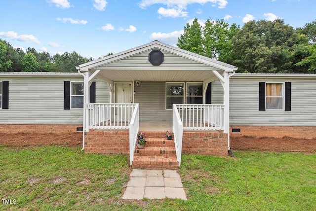 558 Christys Way, Roxboro, NC 27574 - view of front of house featuring covered porch, a front lawn, and a metal roof