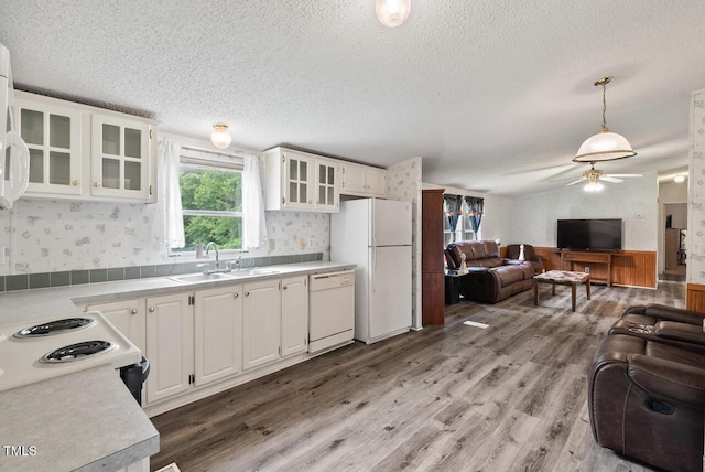 558 Christys Way, Roxboro, NC 27574 - kitchen featuring white appliances, a textured ceiling, a ceiling fan, light wood-style floors, and white cabinetry